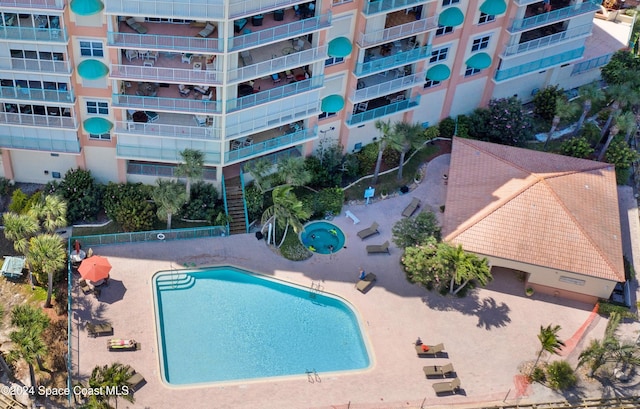 view of pool featuring a patio