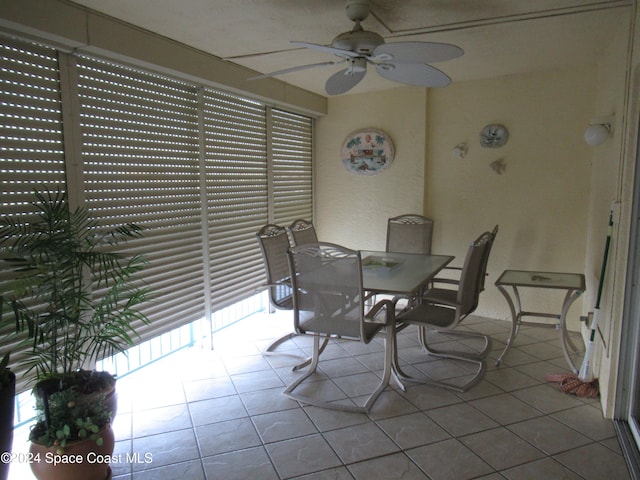 dining room featuring light tile patterned flooring and ceiling fan