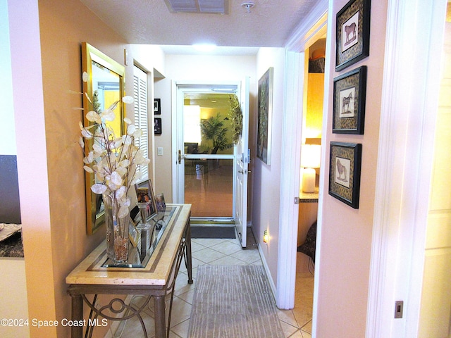 hallway with light tile patterned flooring