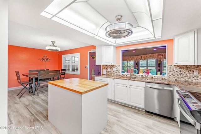 kitchen featuring white cabinets, sink, and appliances with stainless steel finishes