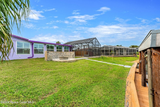 view of yard featuring glass enclosure