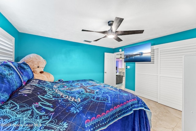 bedroom with tile patterned flooring and ceiling fan