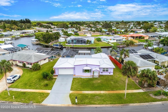 birds eye view of property with a water view