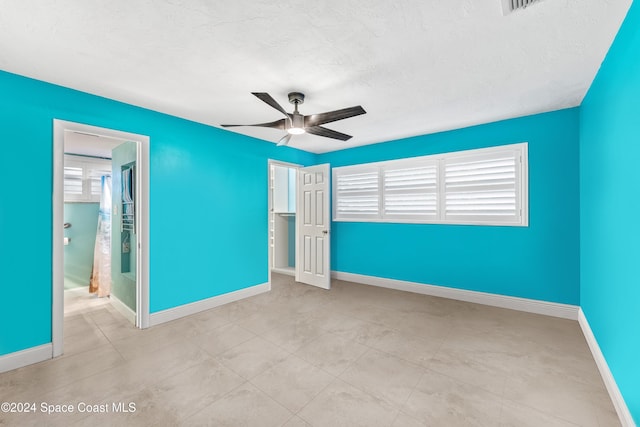 unfurnished room with ceiling fan