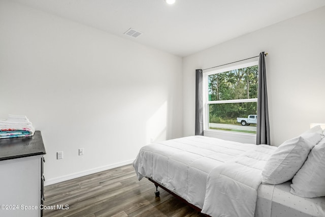 bedroom featuring hardwood / wood-style flooring