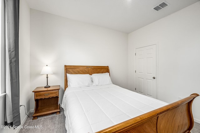 bedroom with light carpet