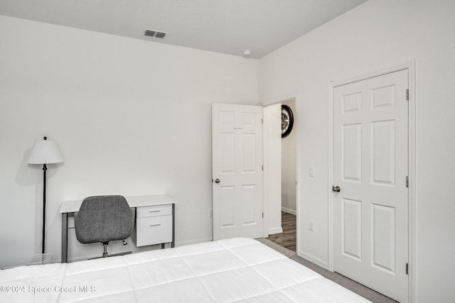 bedroom featuring wood-type flooring