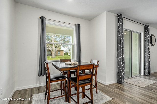 dining area with wood-type flooring