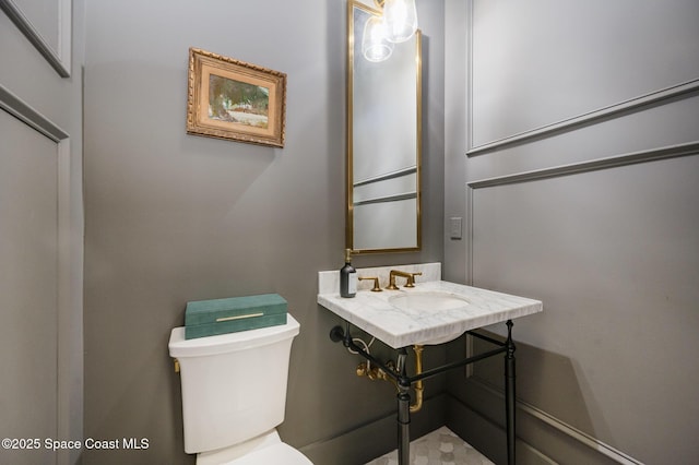 bathroom with sink and toilet