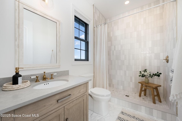 bathroom featuring vanity, toilet, and a shower with shower curtain