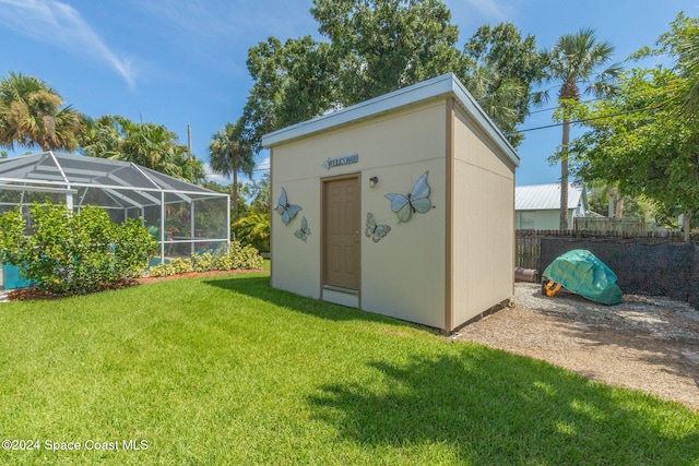 view of outdoor structure with a lawn