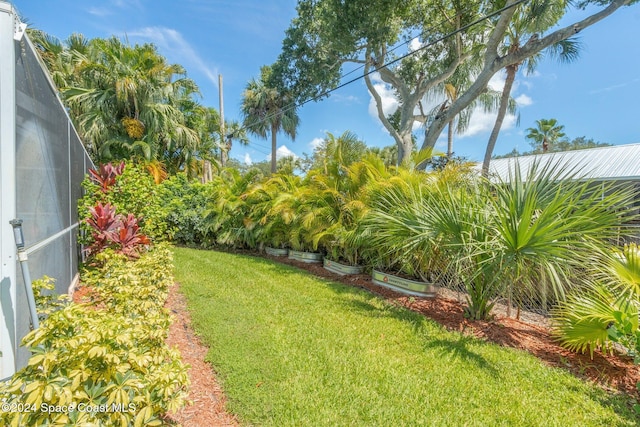 view of yard featuring a lanai