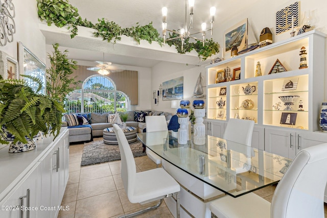 tiled dining space featuring ceiling fan