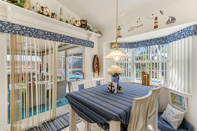 dining space with lofted ceiling