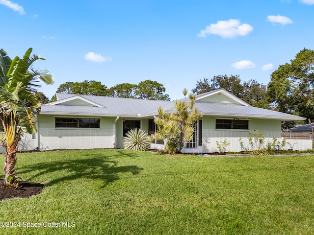 ranch-style home featuring a front yard