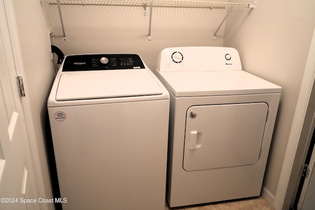 washroom featuring independent washer and dryer