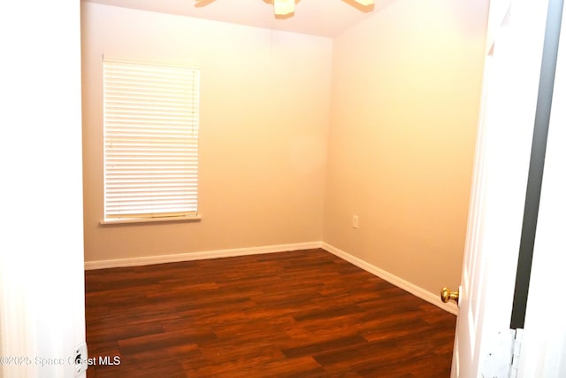 unfurnished room with dark wood finished floors, baseboards, and ceiling fan