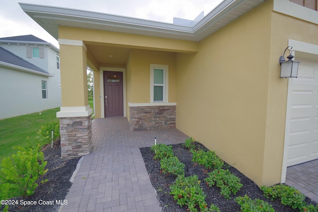 entrance to property featuring a garage