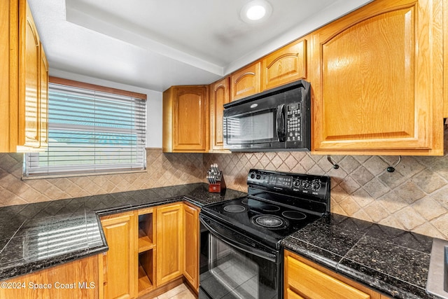 kitchen with backsplash and black appliances