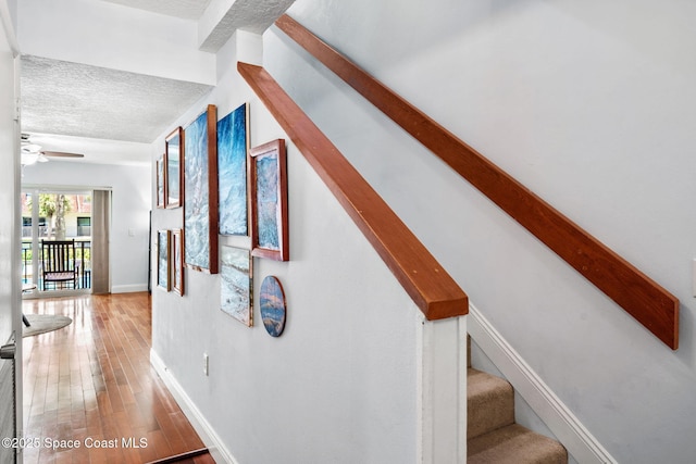 170 Paradise Blvd Unit 17013, Melbourne, FL 32903 - stairway with a textured ceiling, wood finished floors, and ceiling fan