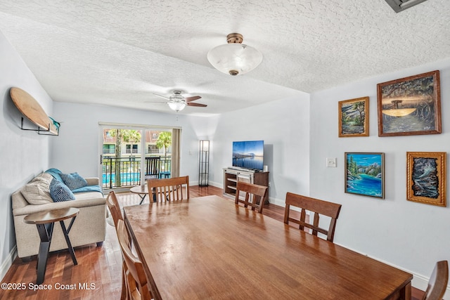 170 Paradise Blvd Unit 17013, Melbourne, FL 32903 - dining room with a textured ceiling, wood finished floors, and a ceiling fan