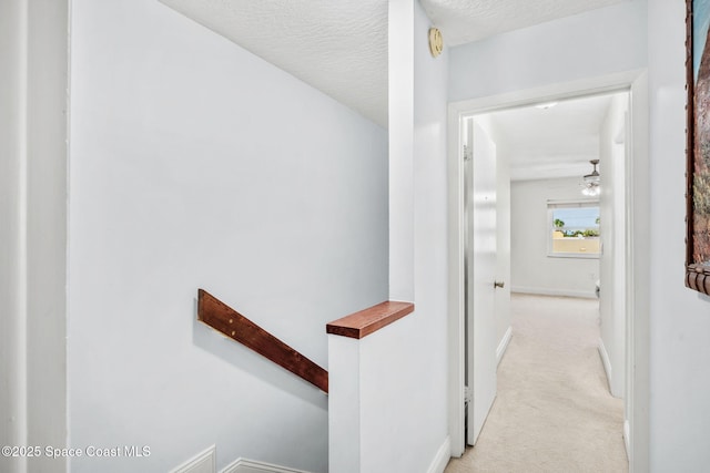 170 Paradise Blvd Unit 17013, Melbourne, FL 32903 - hall with an upstairs landing and light colored carpet