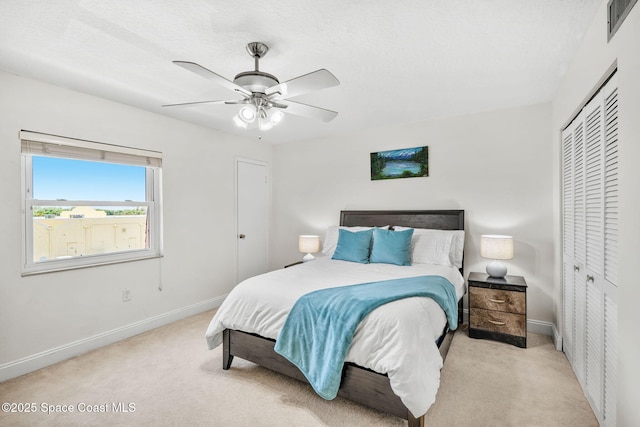 170 Paradise Blvd Unit 17013, Melbourne, FL 32903 - carpeted bedroom with a closet and a ceiling fan