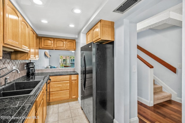170 Paradise Blvd Unit 17013, Melbourne, FL 32903 - kitchen featuring freestanding refrigerator, tasteful backsplash, recessed lighting, and tile countertops