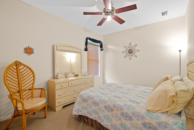 bedroom featuring light carpet and ceiling fan