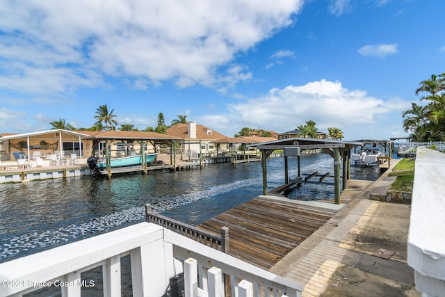 1730 E Central Ave, Merritt Island, FL 32952 - dock featuring boat lift and a water view