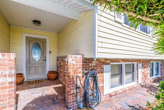 1730 E Central Ave, Merritt Island, FL 32952 - doorway to property with brick siding