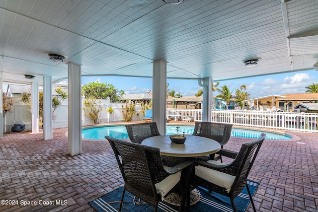 view of patio / terrace with a fenced in pool