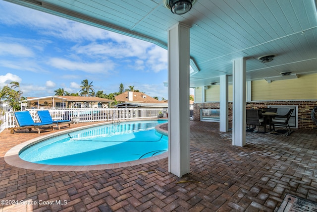 view of pool featuring a patio area