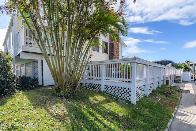 1730 E Central Ave, Merritt Island, FL 32952 - view of side of property with a wooden deck