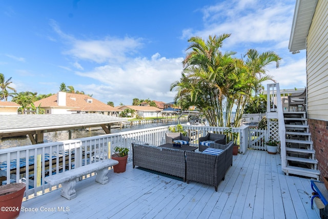 1730 E Central Ave, Merritt Island, FL 32952 - wooden deck featuring an outdoor living space, a water view, and stairway