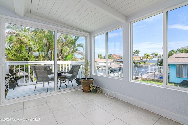 1730 E Central Ave, Merritt Island, FL 32952 - sunroom with a water view, baseboards, and tile patterned flooring