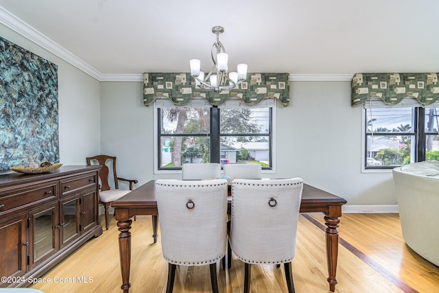 dining room featuring a chandelier, crown molding, a healthy amount of sunlight, and light hardwood / wood-style flooring