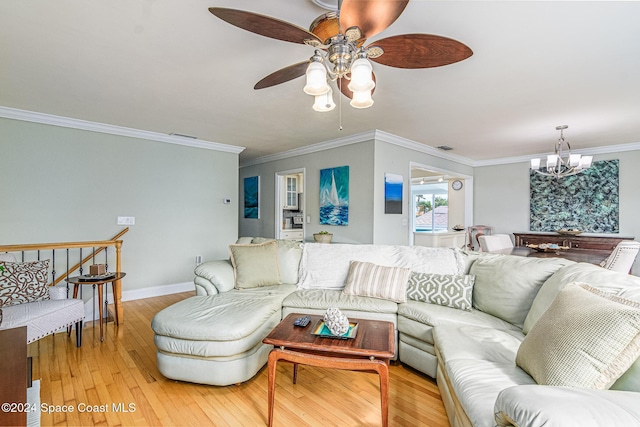 1730 E Central Ave, Merritt Island, FL 32952 - living room featuring a chandelier, light wood finished floors, ceiling fan, crown molding, and baseboards