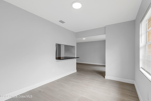 empty room with light hardwood / wood-style floors