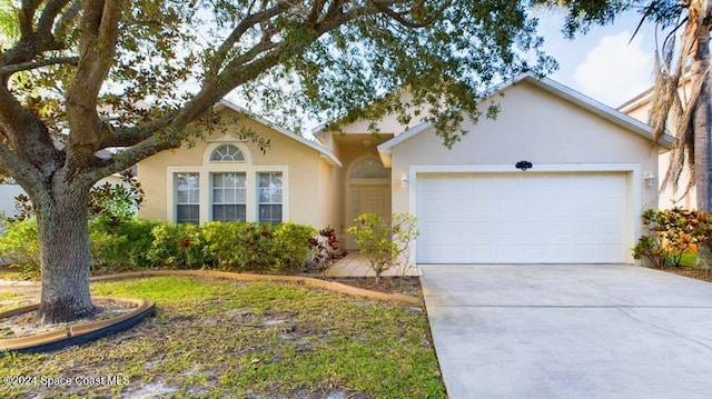 single story home featuring a garage