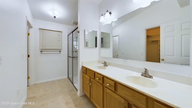 bathroom with vanity, walk in shower, tile patterned floors, and lofted ceiling