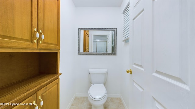 bathroom featuring tile patterned floors and toilet