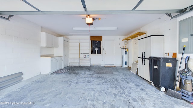 garage featuring water heater and a garage door opener