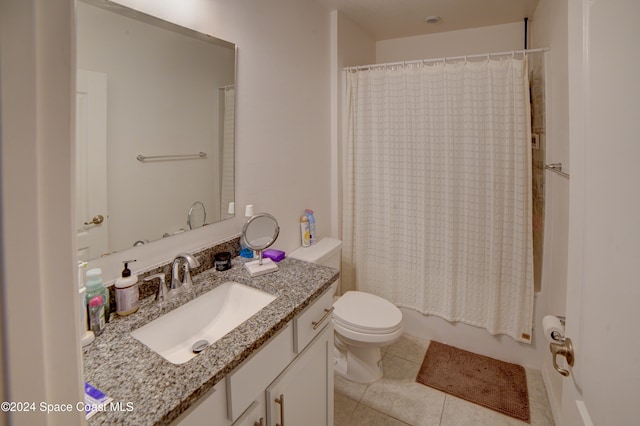 full bathroom with vanity, shower / bath combo, tile patterned floors, and toilet