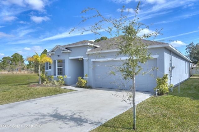 view of front of house with a garage and a front yard