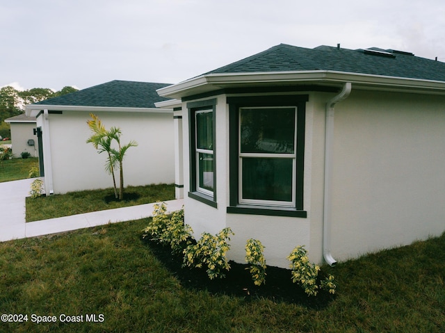 view of home's exterior featuring a lawn