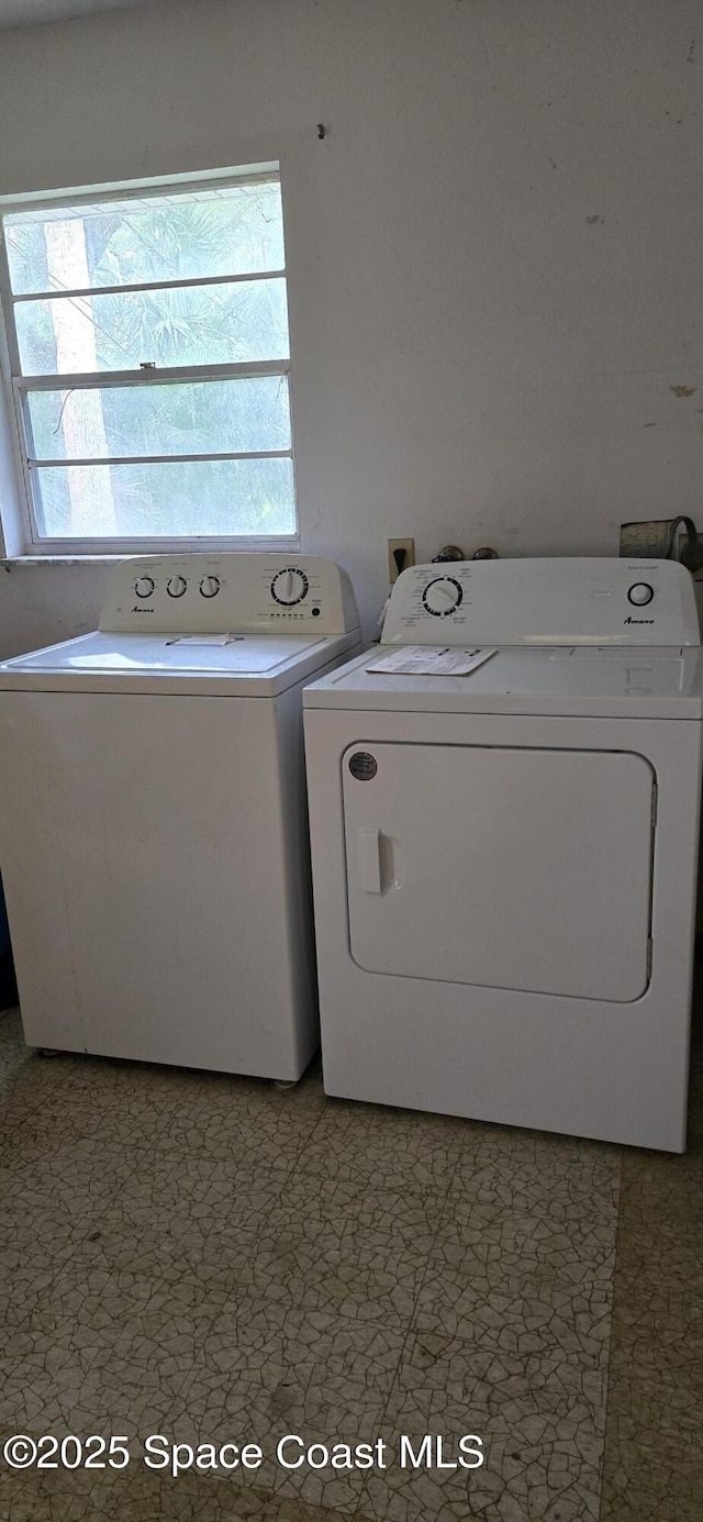 laundry area featuring washing machine and dryer