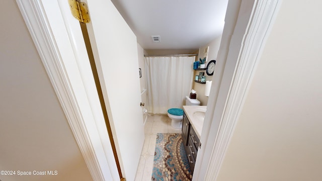 bathroom with toilet and vanity