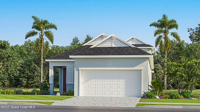 view of front of home with decorative driveway, a garage, roof with shingles, and stucco siding