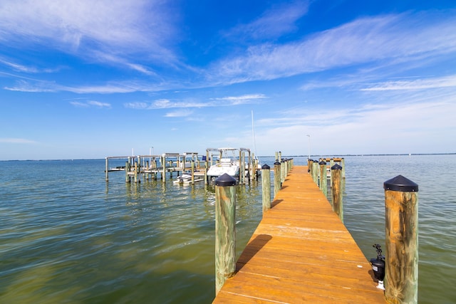 view of dock featuring boat lift and a water view